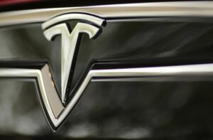 Tesla and Rivian Lead Friday’s Morning Market Cap Stock Movers By Investing.com