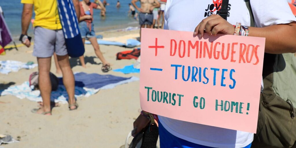 Tourism in Spain is booming, despite protests that included spraying visitors with water guns