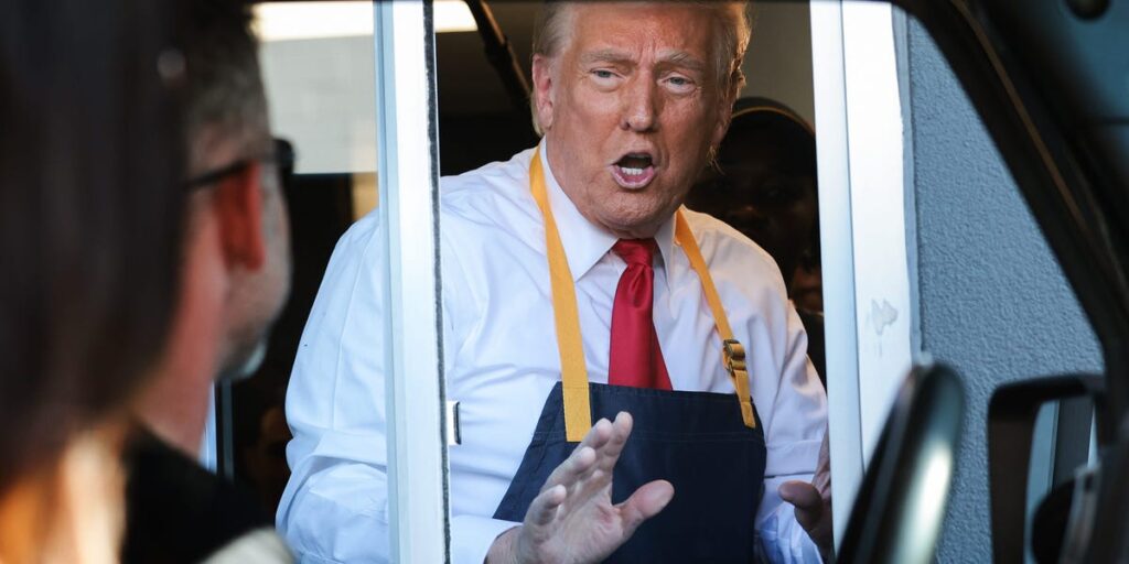 Trump takes orders and cooks fries at McDonald’s, as he attempts to cast doubt on Harris’ earlier employment at the chain