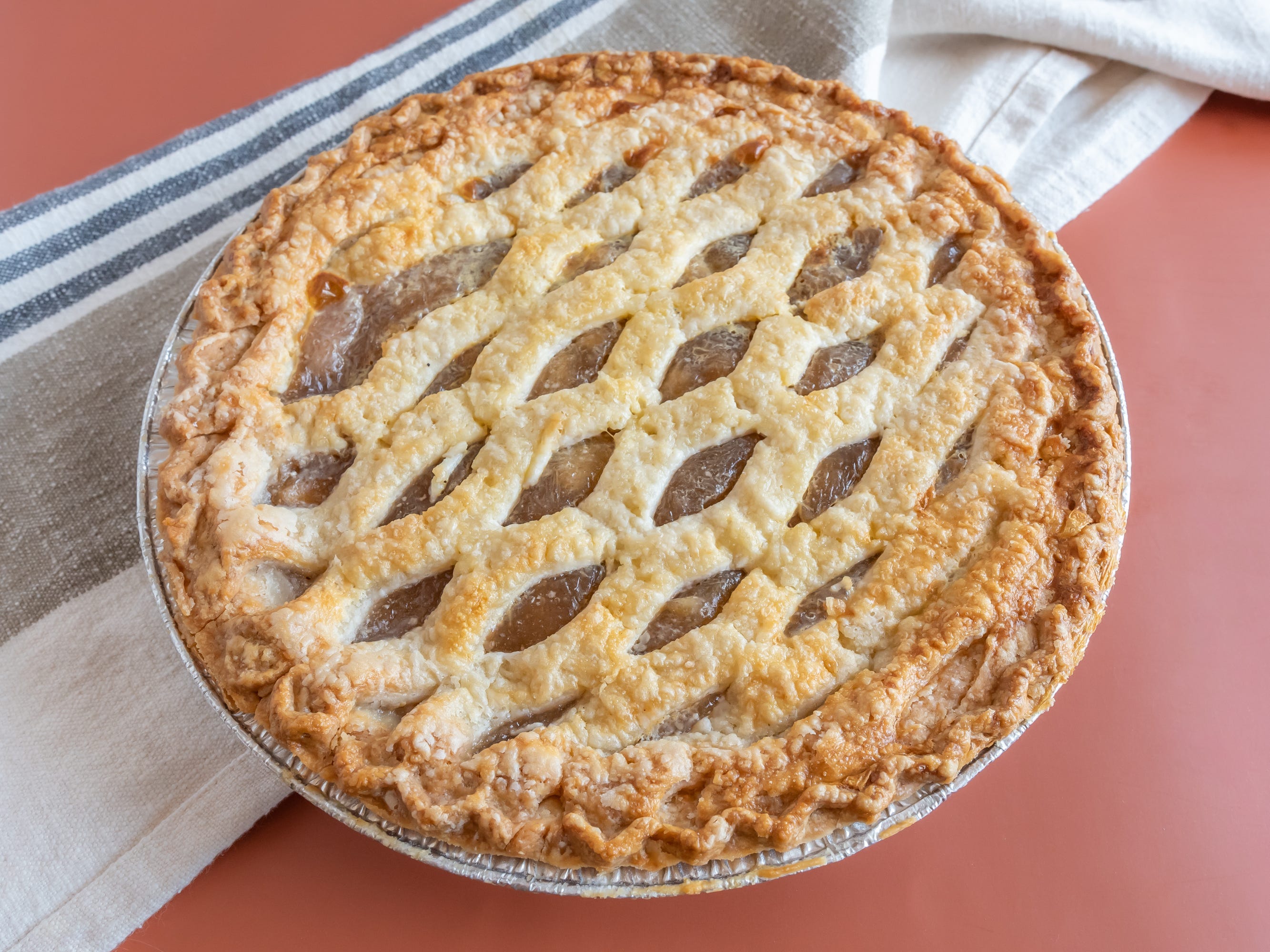 whole apple pie from safeway on red table