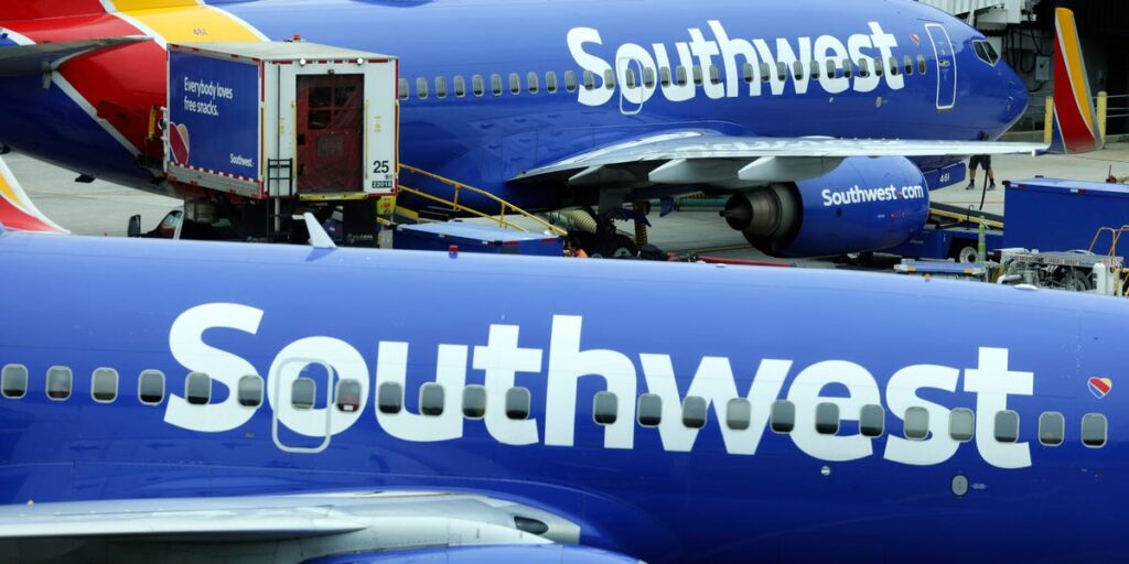 Southwest Airlines is pressing pause on hiring and staff rallies to cut costs