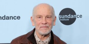 John Malkovich plays an eccentric, hip-thrusting pop star in ‘Opus.’ He’s not sure why he was the director’s first choice for the role.