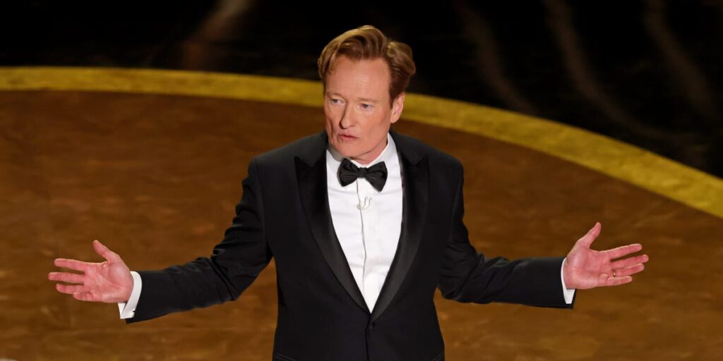 Conan O’Brien’s 2025 Oscars monologue took shots at Karla Sofía Gascón’s controversy — with her in the audience