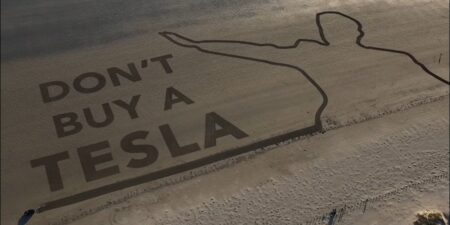 Activists used a Tesla to write ‘Don’t buy a Tesla’ on a beach in Wales