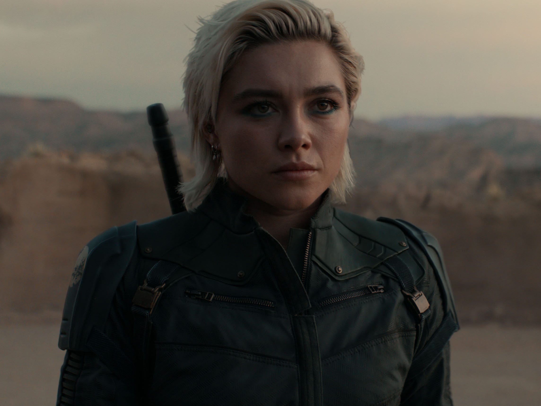 A still of "Thunderbolts*" showing Florence Pugh wear a black outfit and dark eyeliner.