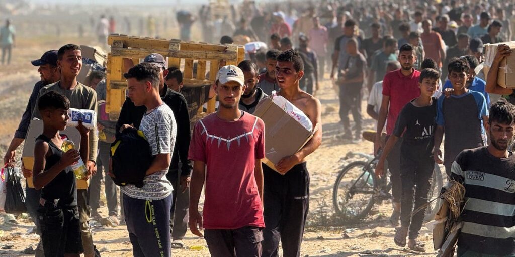 Chaos erupts after thousands of Palestinians rush to grab aid in Gaza