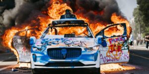 Waymo Pauses Rides Near LA Protests After 5 Cars Are Lit on Fire