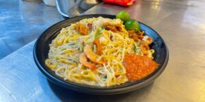 The Gen Zer Who Works 14-Hour Days Running a Noodle Stall in Singapore