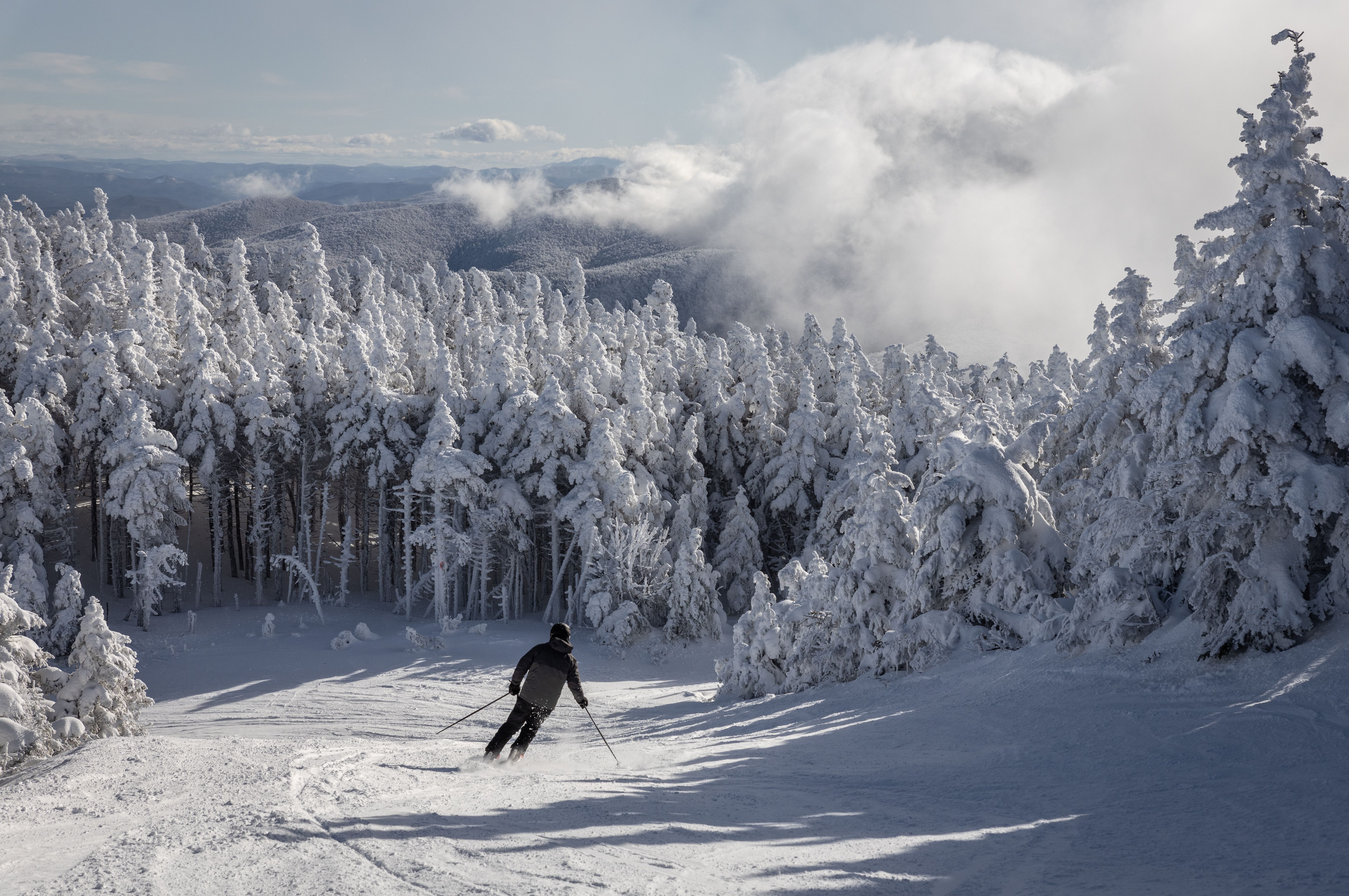 A skiier descending the Green Mountains in Vermont