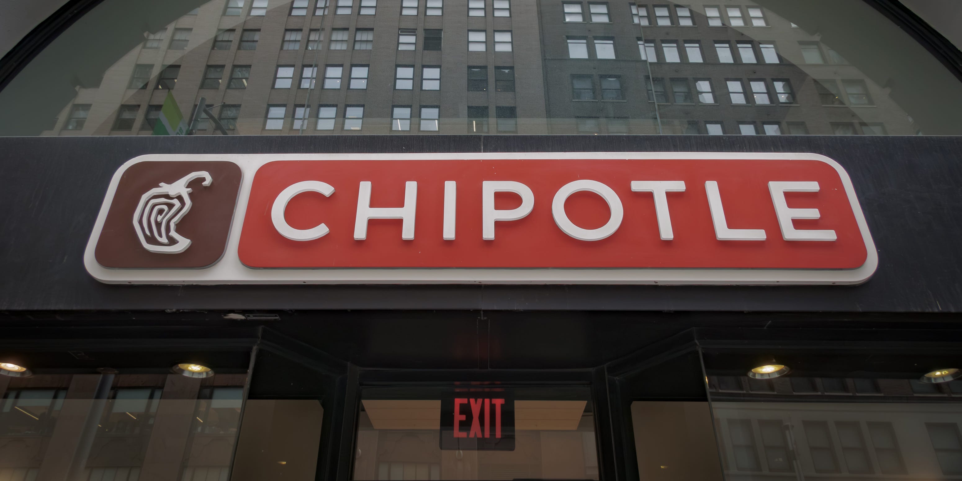 The Chipotle logo is seen on the exterior of an office building