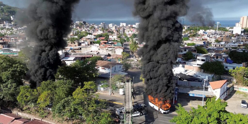 Photos show burned-out cars, empty streets, and airport chaos in Mexico after a major cartel leader was killed