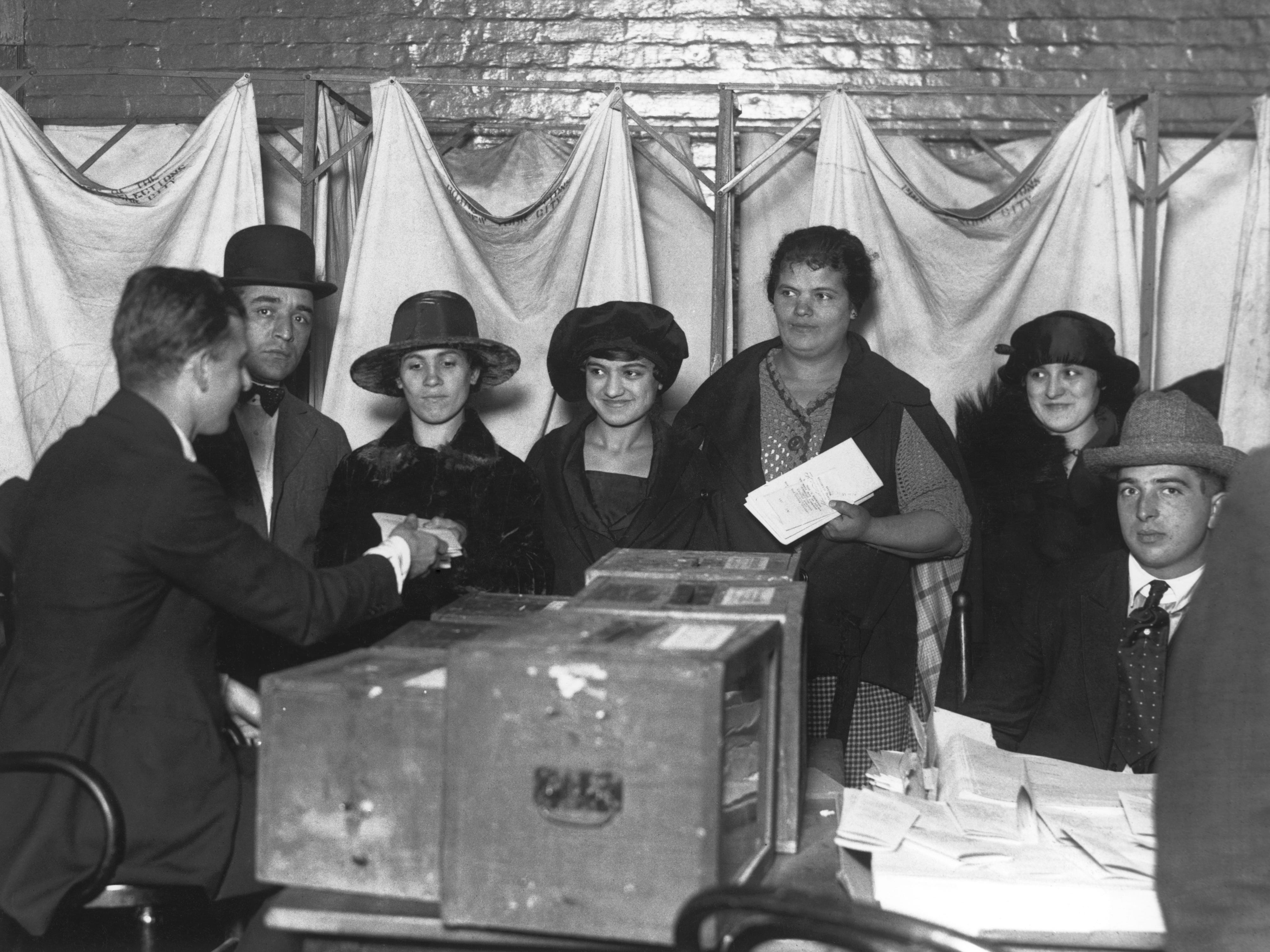 Women casting their first votes for president in November 1920, New York City.