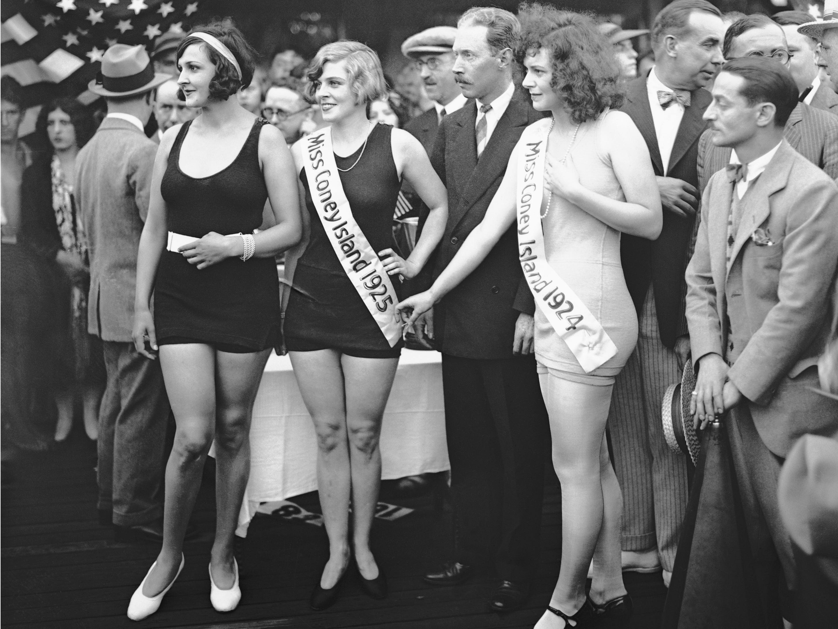 Marcella Miller, Kathryn Ray, and Agnes Leonard at a Miss Coney Island pageant in the 1920s. Ray wore a sash that read, "Miss Coney Island 1925" and Leonard wore a sash that read, "Miss Coney Island 1924."