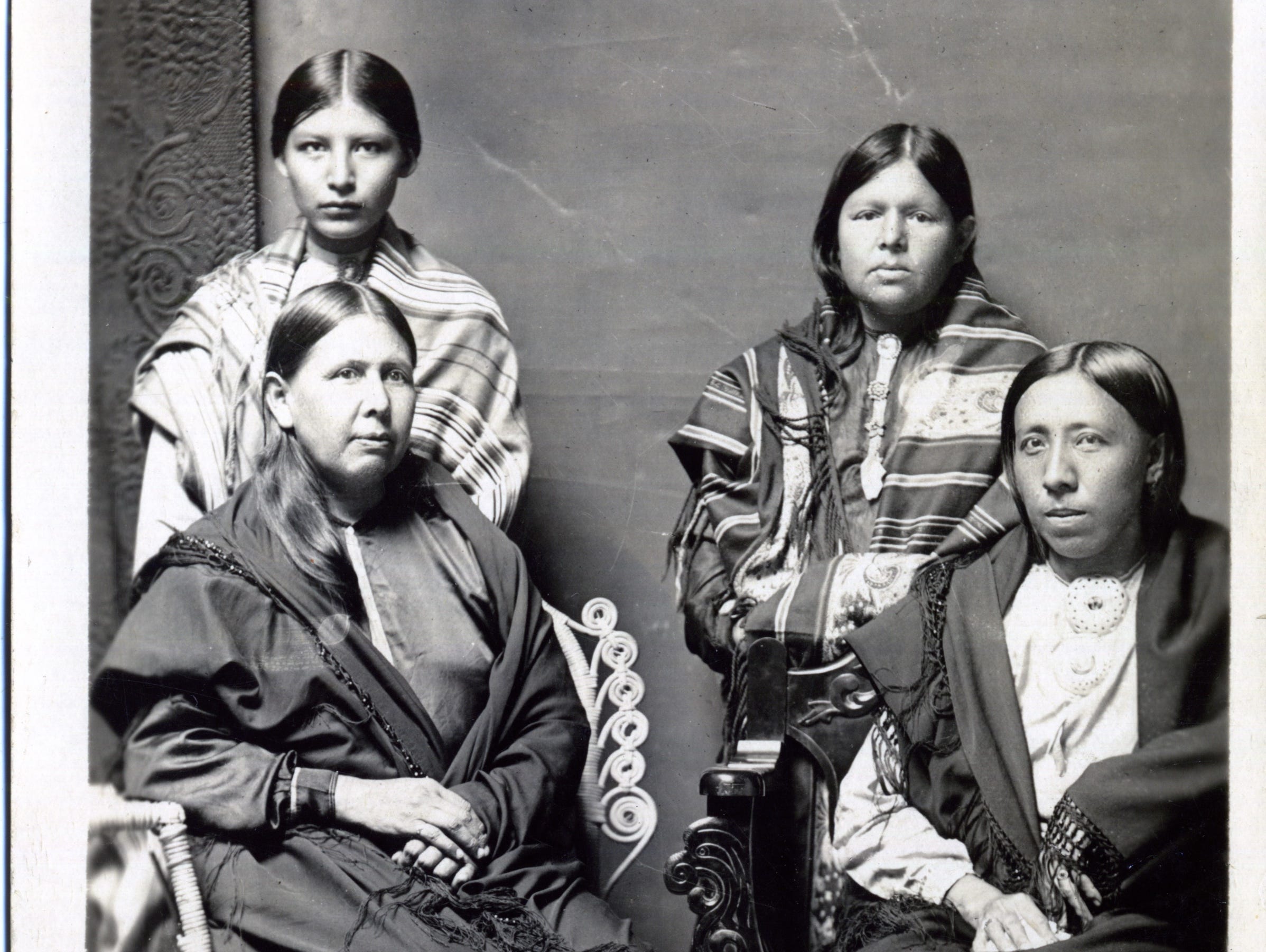 A portrait of an Osage woman and her three children circa 1918-1922.