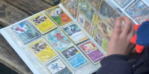 I pay my 8-year-old with Pokémon cards for his chores. It motivates him more than getting money.