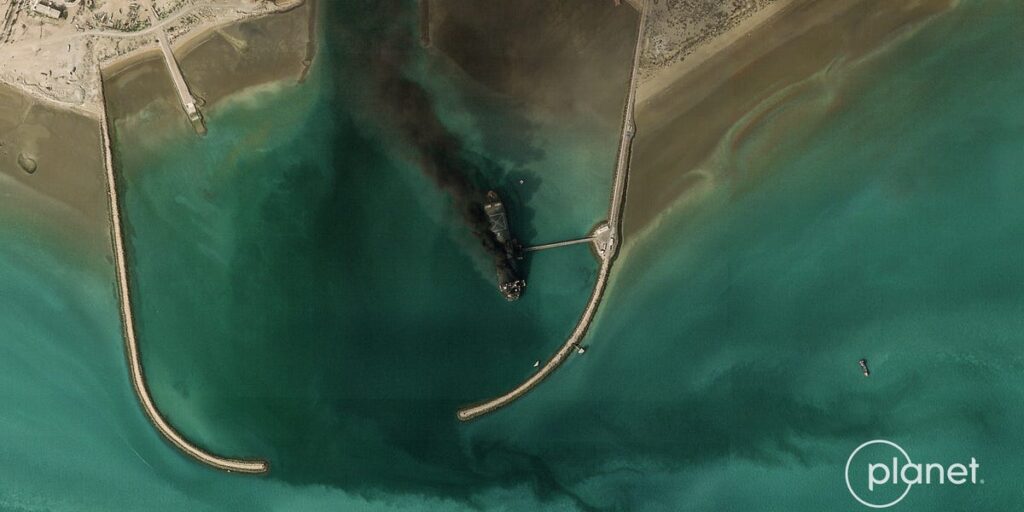 Satellite image shows Iran’s largest naval vessel, a tanker-turned-warship, smoking in port Satellite image shows Iran’s largest naval vessel, a tanker-turned-warship, smoking in port