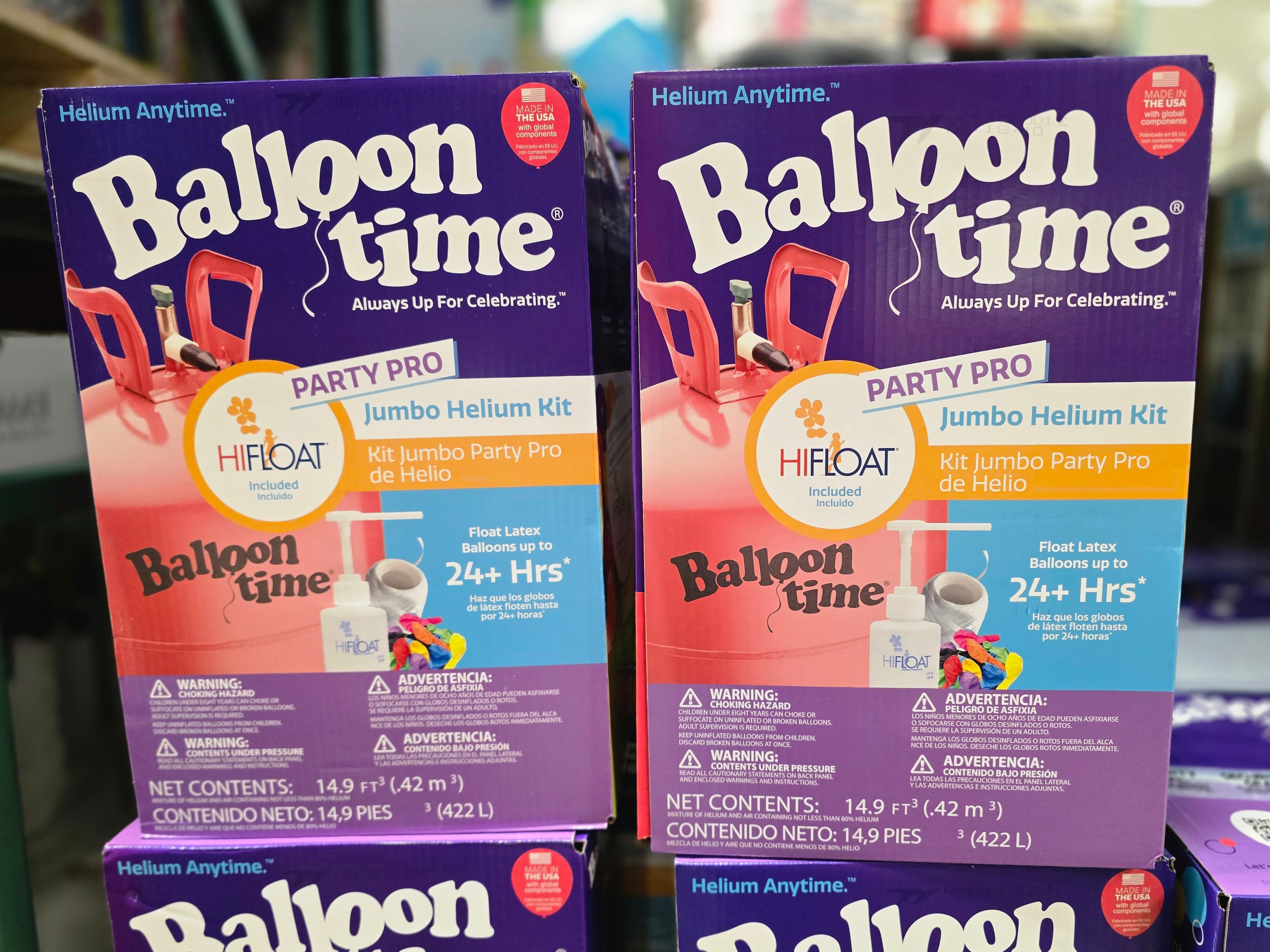 Boxes of Balloon Time helium tanks on display at Costco.