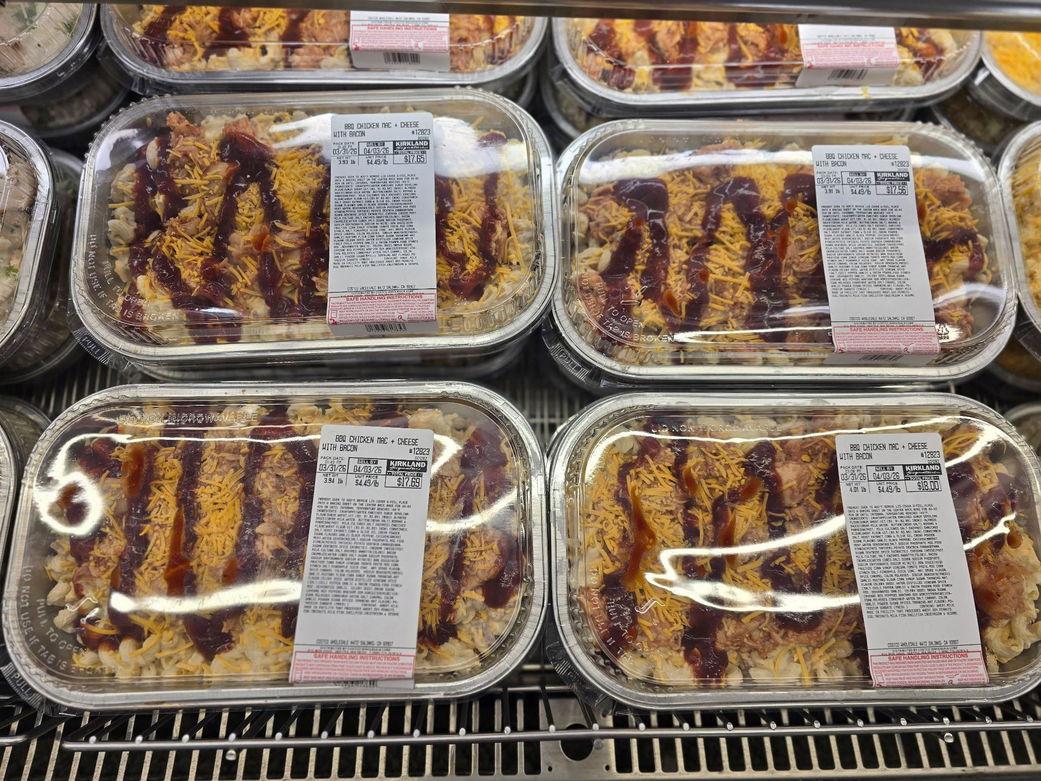 Packages of premade barbecue chicken mac and cheese on display at Costco.