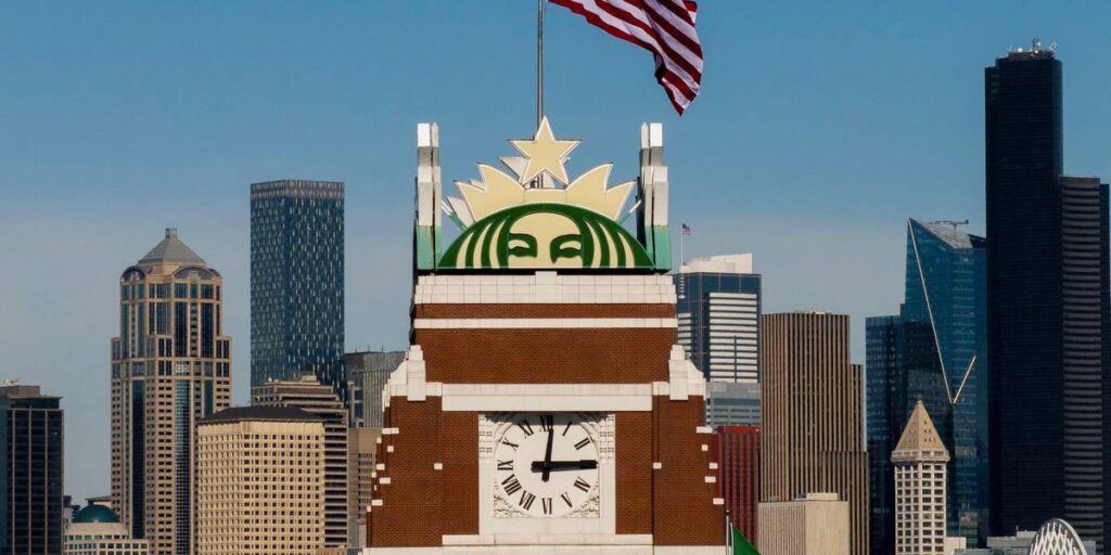 Starbucks says its turnaround is gaining momentum and cuts 300 more jobs
