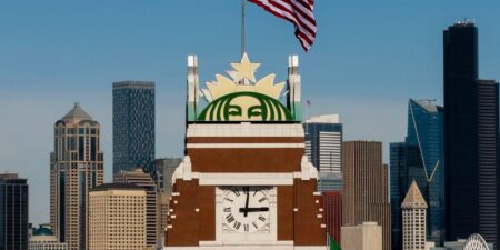 Starbucks says its turnaround is gaining momentum and cuts 300 more jobs