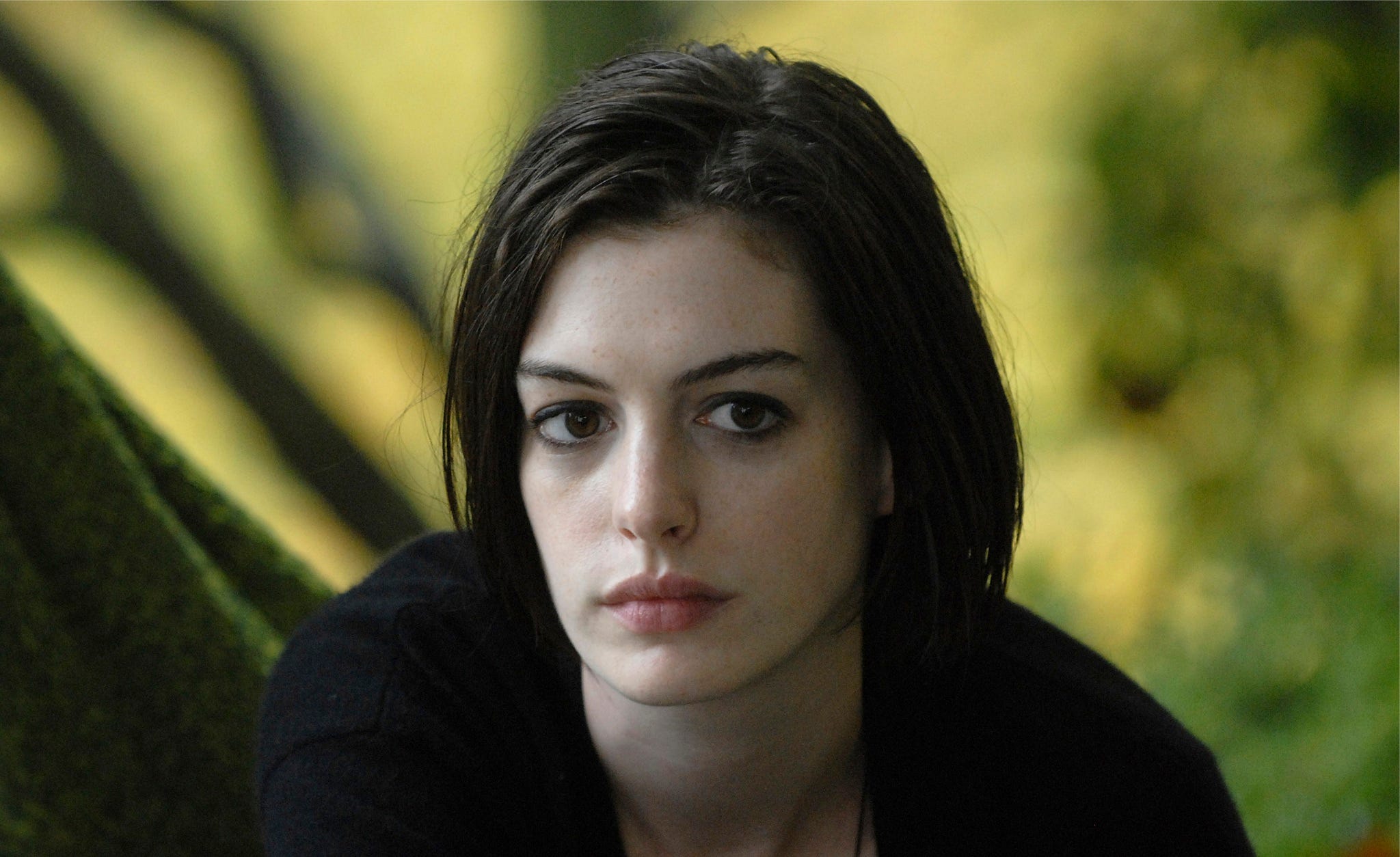 Anne Hathaway in a dark shirt