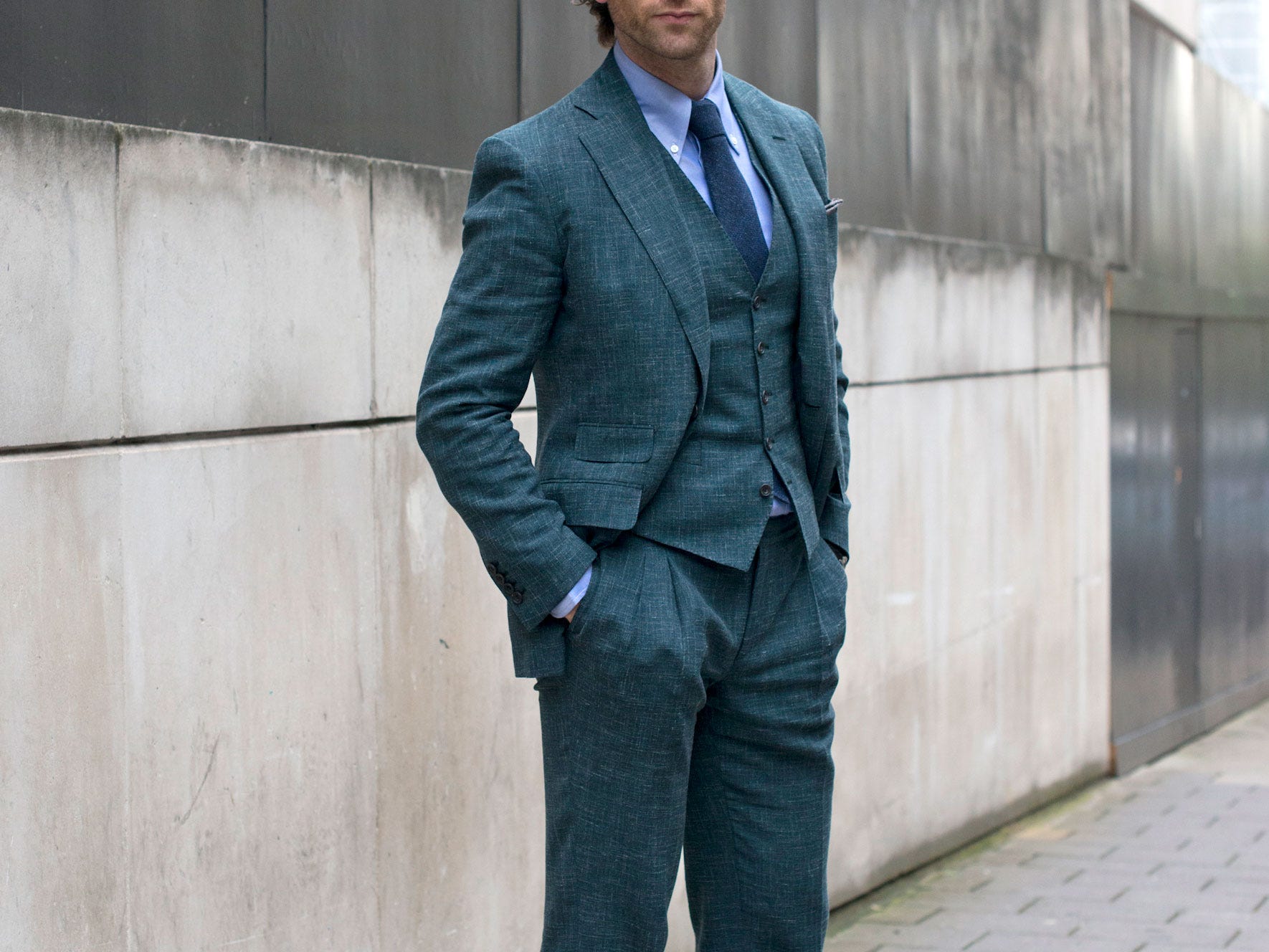 A man wearing a three-piece suit.