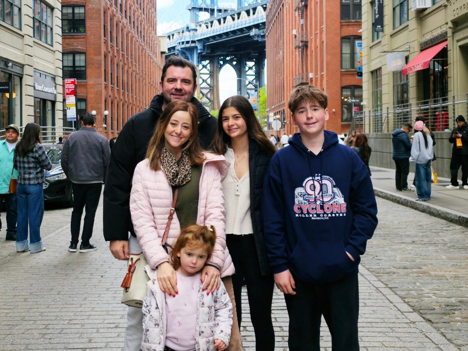 Family smiling in NYC
