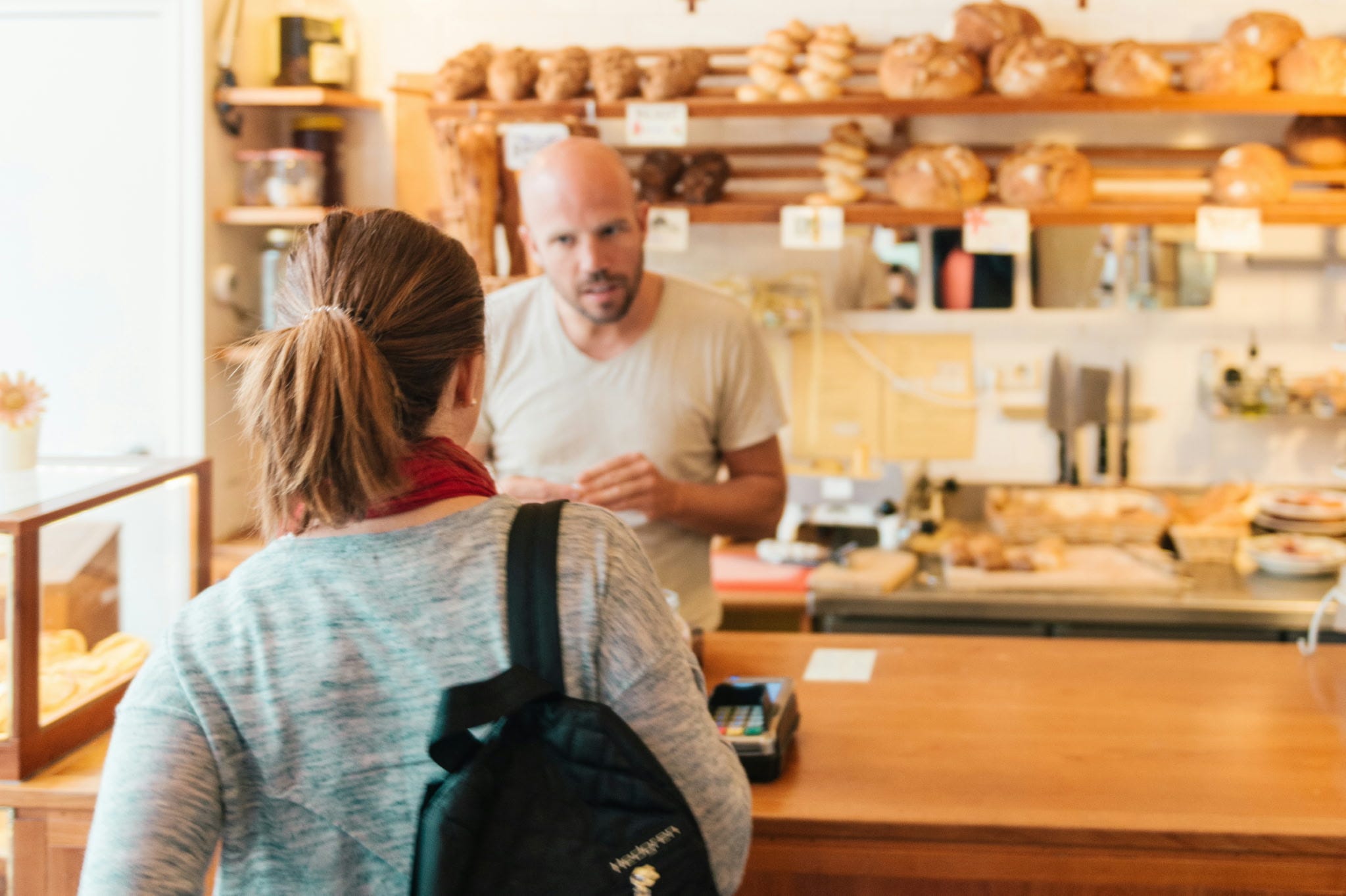 Woman ordering bread at bakery