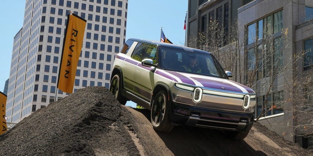 RJ Scaringe said there are 2 big reasons Rivian’s new R2 doesn’t look like a Tesla Model Y dupe