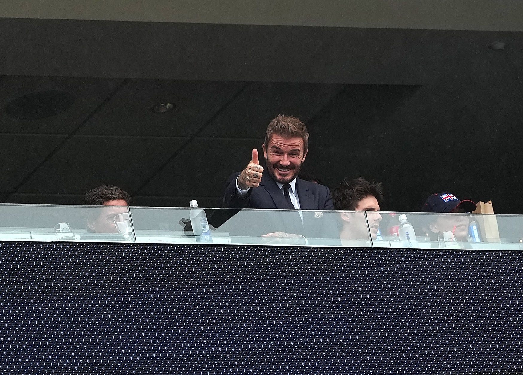 Former England footballer David Beckham 2nd L reacts before the group L match between England and Ghana at the 2026 FIFA World Cup at Boston Stadium in Boston, the United States, June 23, 2026.