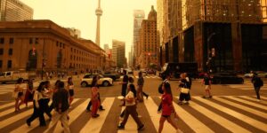 Canadian wildfires are shrouding US cities in smoke and yellow haze. See the eerie photos.