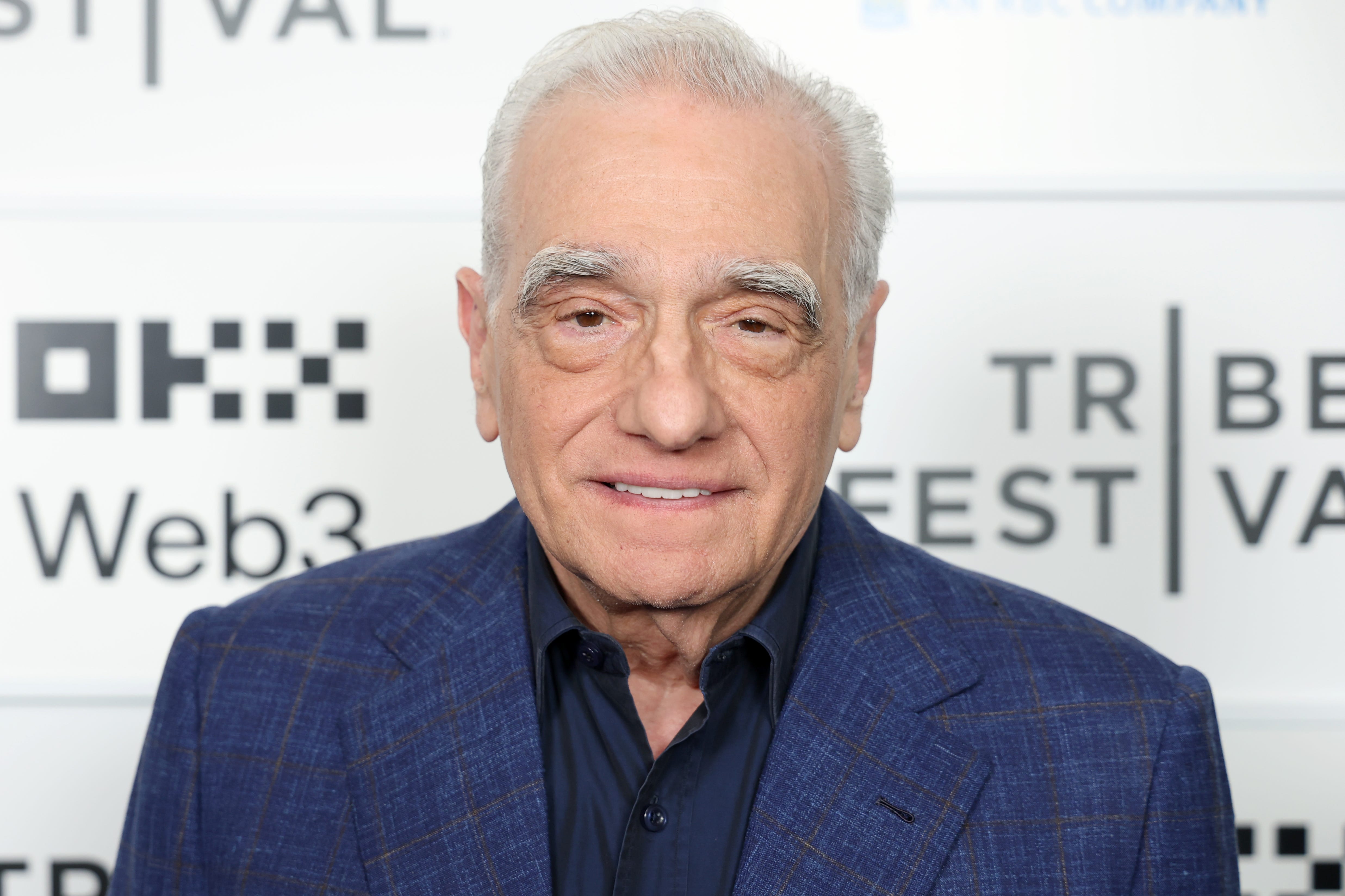 Martin Scorsese in a blue suit jacket