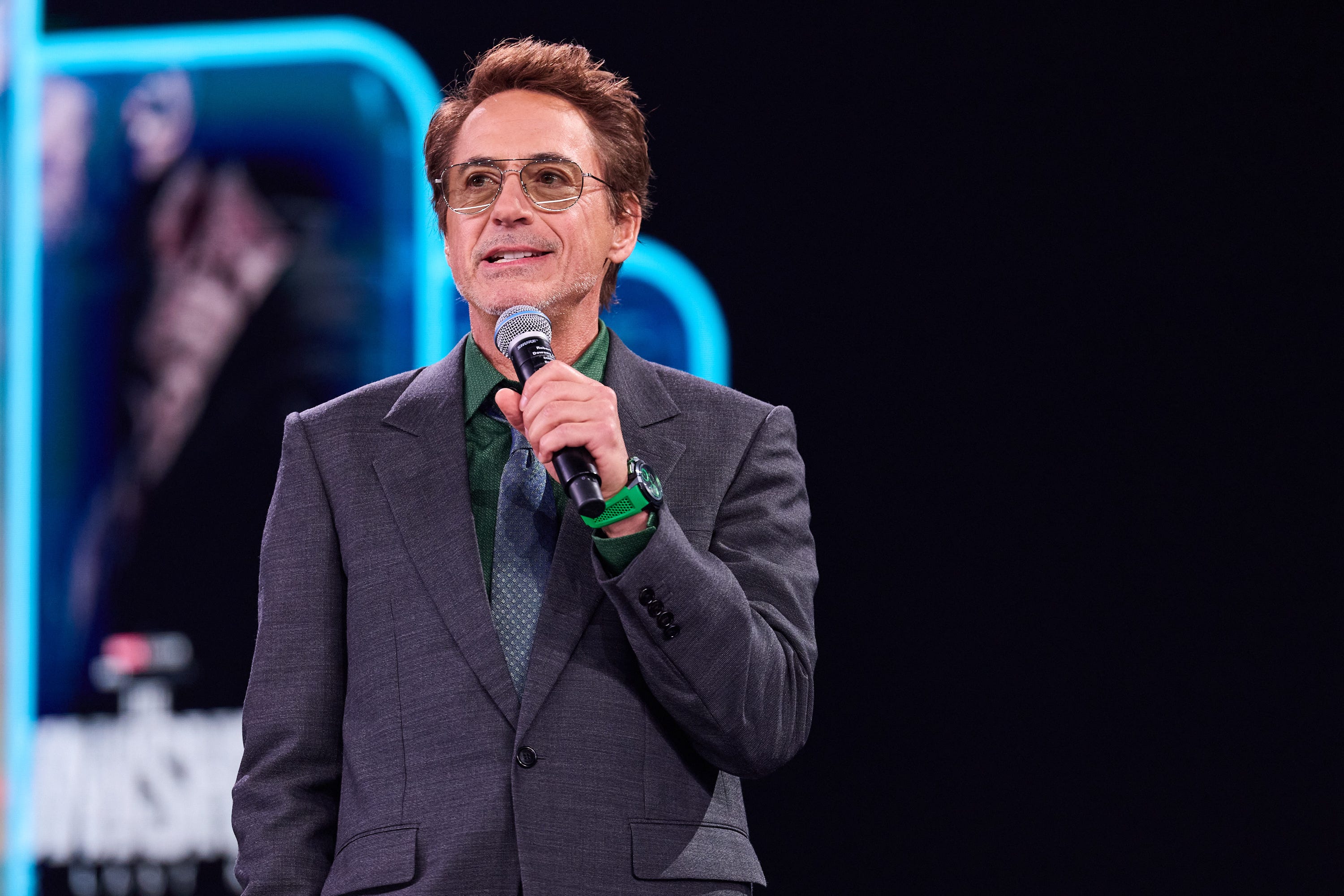 Robert Downey Jr. holding a microphone