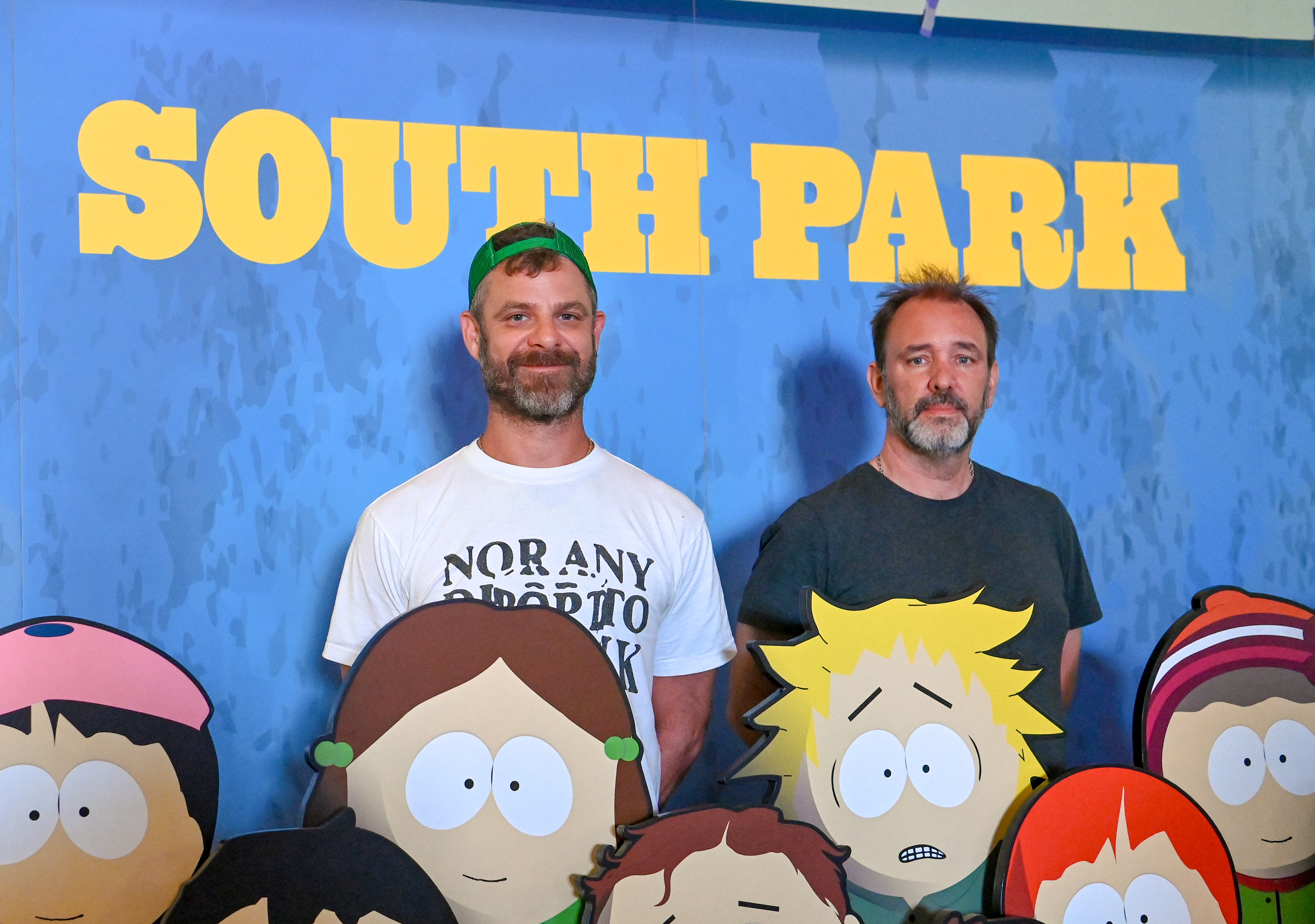 Matt Stone and Trey Parker surrounded by cutouts of South Park characters