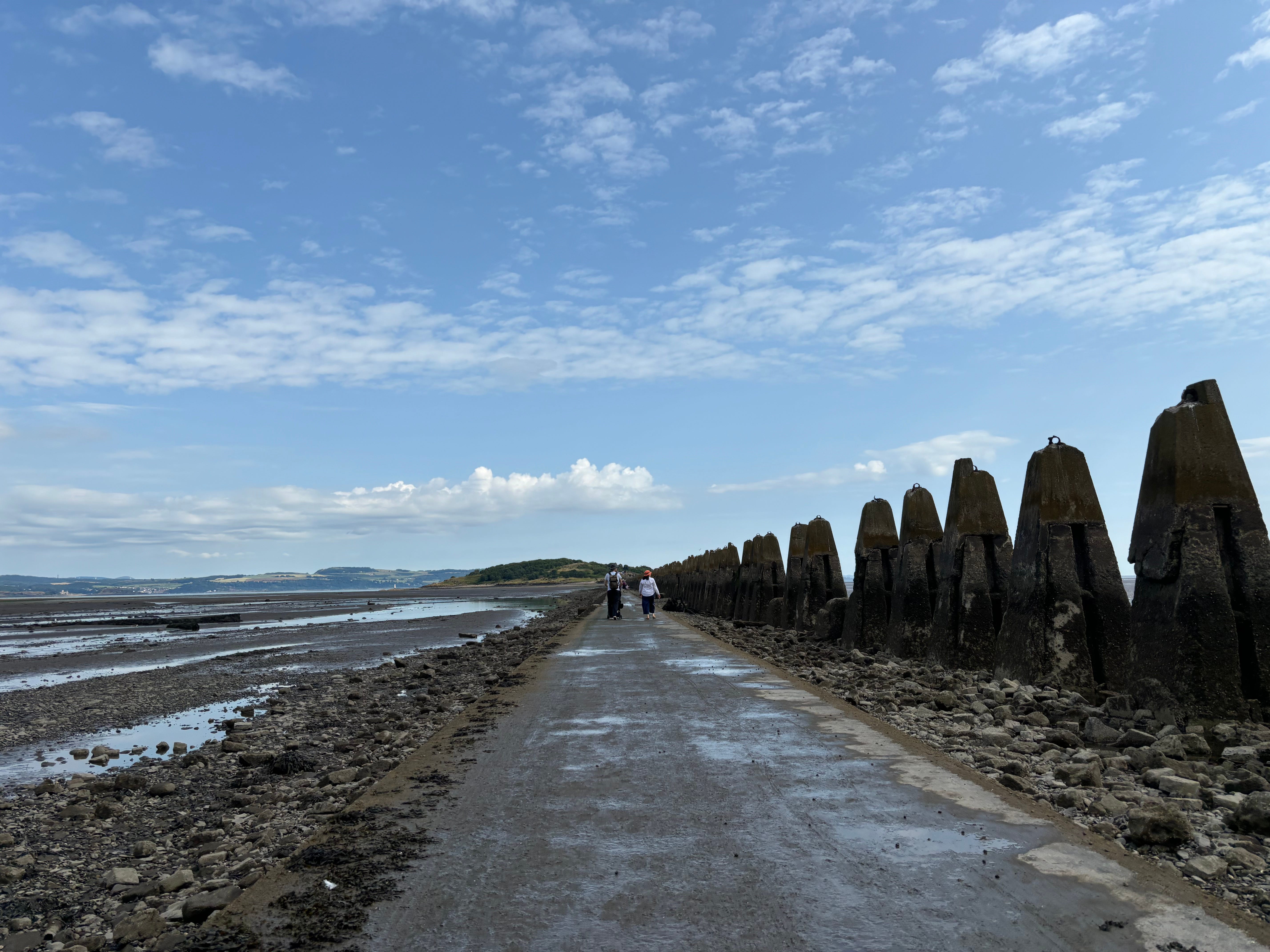 A wide shot of the walk to Cramond Island.