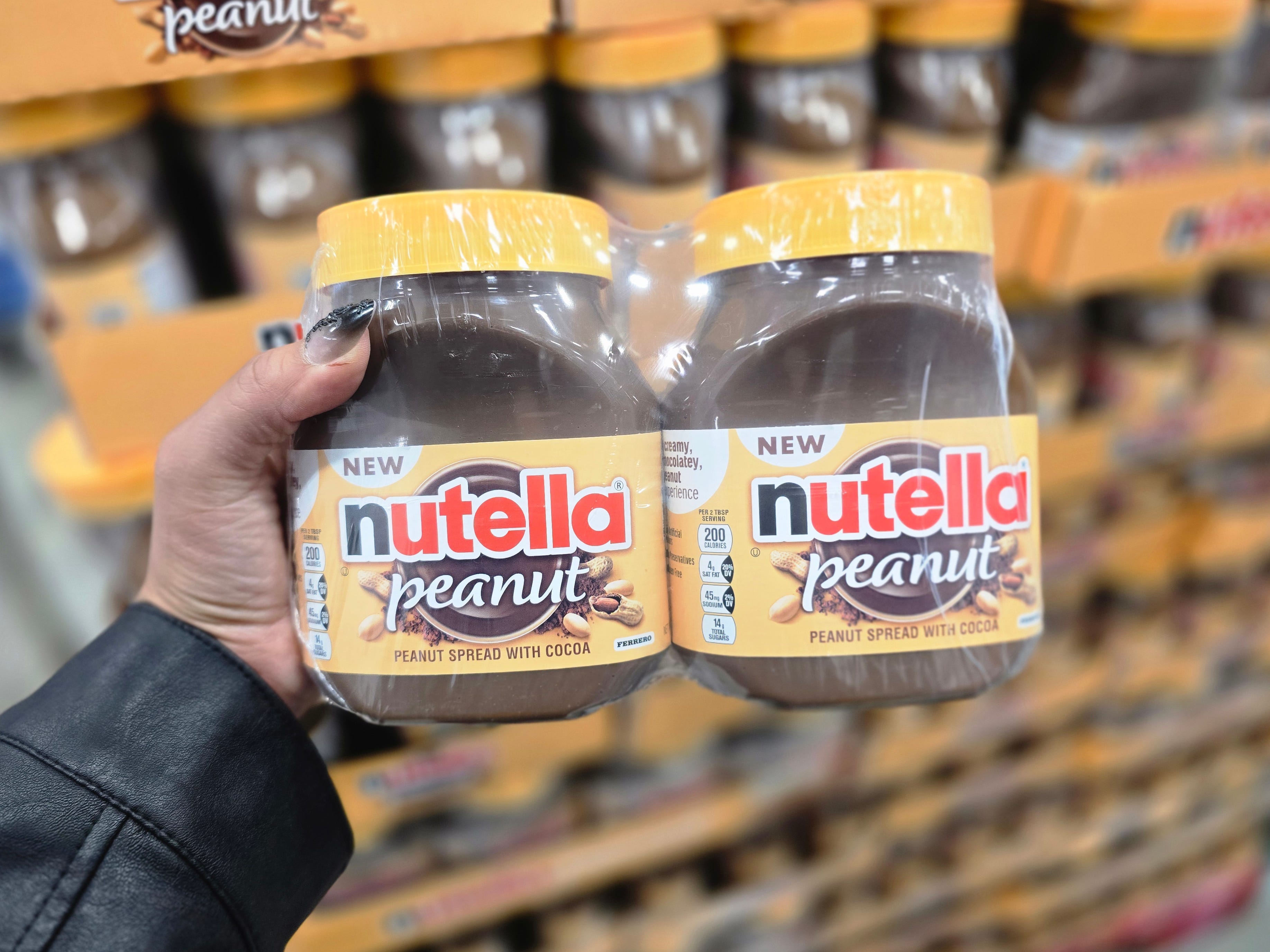 Veronica holds a twin pack of peanut Nutella.