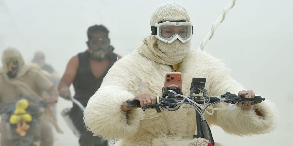 19 surreal photos show the mud, chaos, and glamour of Burning Man